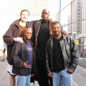 Los Angeles, CA 12/15/03: Peter Cornell, Shaquille O'Neal and John Singleton pose for a picture on set of a Burger King commercial shoot.