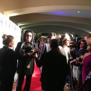 Gene Simmons and the rest of the of KISS on the red carpet at the 2013 AFL's Annual Awards Gala Ryan produced. KISS performed a 30 minute acoustic set at the Gala and Ryan went on to produce ArenaBowl XXVI and the KISS concert in Orlando that week.