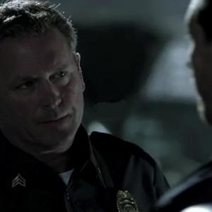 Tony Senzamici as Officer Stetz with Kevin Alejandro on the set of A & E Breakout Kings , episode Cruz Control