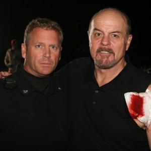 Tony Senzamici as Commander Sykes and Michael Ironside on the set of Mutants.