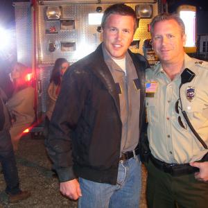 Tony Senzamici as State Trooper Ayme & Lochlyn Munro on the set of Xtinction.