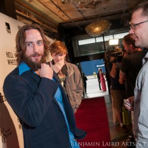 Phil Burke and Ben Esler walk the red carpet at the Hell on Wheels Season 3 Premiere.