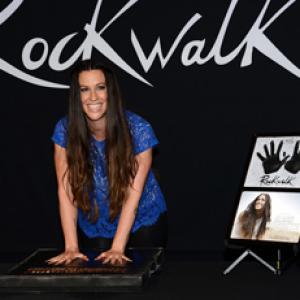 Alanis Morissette at Rockwalk Induction 8-21-2012 with commemorative plaque designed and fabricated by Dreamland-3D.com