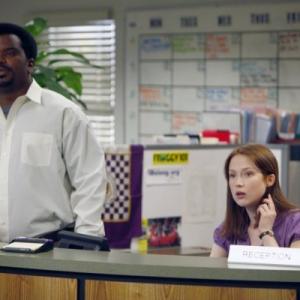 Still of Craig Robinson and Ellie Kemper in The Office 2005