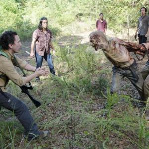 Aiden (Daniel Bonjour) struggles with a walker. The Walking Dead