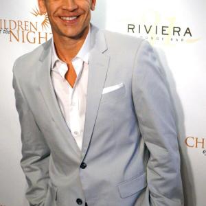 Actor David Barnes on the red carpet for Bench Warmer benefit at Riviera31 in Beverly Hills July 1st 2014.