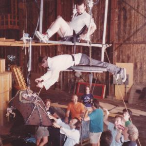 Gremlins 2 (1990) 1st Unit. Demonstration of Bat Gremlin rig. Tim Lawrence in telemetric saddle. Steve Sleap on wings. Joe Dante, Rick Baker and John Hora also present.
