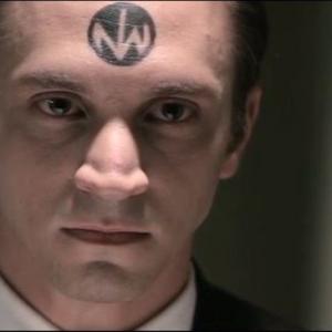 Kevin Herrmann as the NWO Official in New World Order The End Has Come