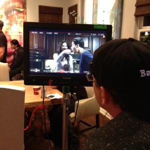 Director Brandon Thomas checking monitor on set of Doritos commercial