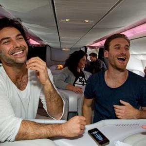 Aidan Turner and Dean OGorman being interviewed by the media on board Air New Zealand special The Hobbit air plane during flight to world premiere of The Hobbit An Unexpected Journey