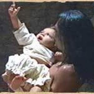 Baby Jesus JuanSalvador Carrasco points towards heaven as he is embraced by Topiltzin Damin Delgado in The Other Conquest