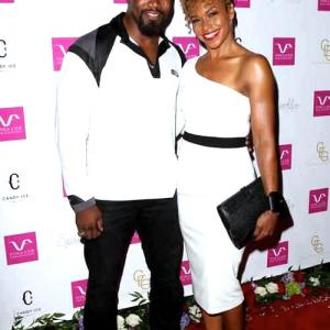 Gillian Waters and fiancee Michael Jai White on the red carpet at Vivica Fox's 50th birthday celebration in Beverly Hills.