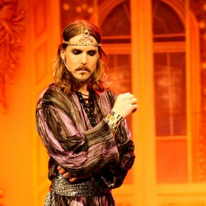 Still of Matt Wiggins as King Xerxes in a live Baller performance of Esther