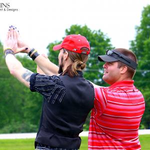 Matt Wiggins receives instruction from PGA pros during his time with the Golf for Injured Veterans Everywhere program
