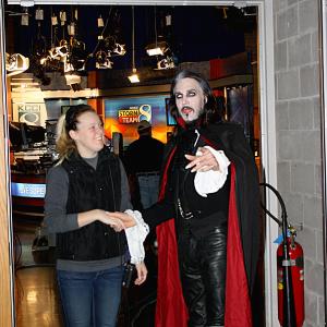 Matt Wiggins arriving for an television interview in full Dracula as he is greeted by a member of the News CH 8 studio production team in Des Moines in October 2013