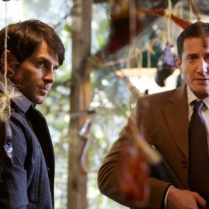 Still of David Giuntoli and Sasha Roiz in Grimm 2011