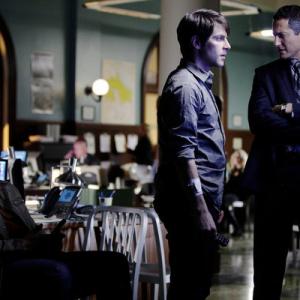 Still of David Giuntoli and Sasha Roiz in Grimm 2011