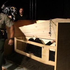 International escape artist Curtis Lovell II Cuffed and locked into a coffin by a police officer httpwwwCurtisLovellcom