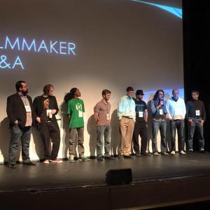 Jason Anthony Fisher center on stage with other filmmakers at the 2015 Marietta International Film Festival in Atlanta Ga