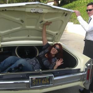 Fileena Bahris and Michael Madsen having fun with the car from Reservoir Dogs