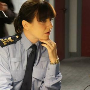 Still from Amber. Emily Nagle as Sgt Karen Mulcahy