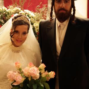 Still of Yiftach Klein and Renana Raz in Lemale et hahalal 2012