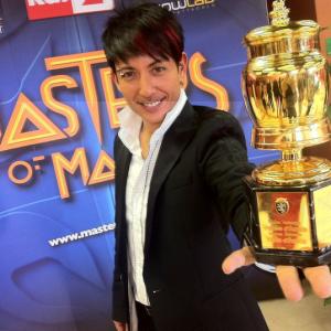 Cyril receives the Golden Grolla Award from the 2011 Masters of Magic!