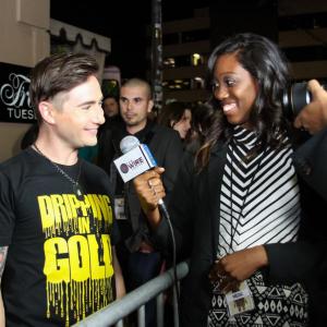 Michael Kuluva being interviewed for WIRE TV at Los Angeles Fashion Week Fall 2013