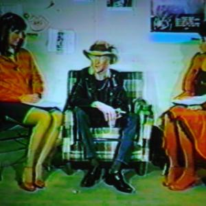Kim Dorsey, Johnny Winter, Vicki Sue Robinson interviewing blues rock guitarist Johnny Winter at Hartford Civic Center.
