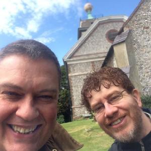 Outside the church of St Lawrence at West Wycombe, seen here with Dr Paolo Russo on a production recce researching 'Hellfire'.
