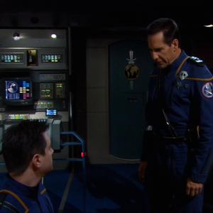 Evan as helmsman Ensign Tanner listening to Captain Archers Scott Bakula speech