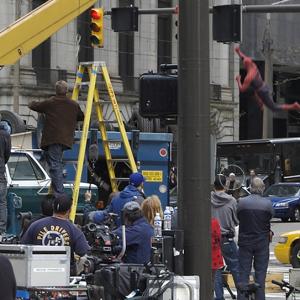 From set of SpiderMan 3 shot in Cleveland In this scene SpiderMan flipped armored truck commandeered by Sandman A precision driver for most of the shoot Logan was pulled for this shot framed with white circle facing camera