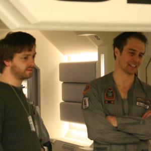 Reviewing footage in the Sarang base set with Sam Rockwell during the studio shoot for Moon 2009