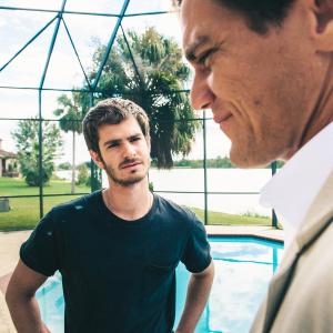 Still of Michael Shannon and Andrew Garfield in 99 Homes 2014
