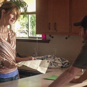 Still of Laura Dern and Andrew Garfield in 99 Homes 2014
