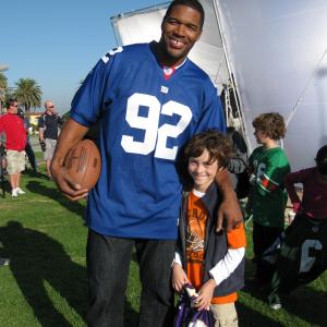 Griffin Cleveland with Michael Strahan on the set of Sports Authority - NFL Play 60 spot.