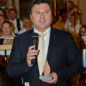 Director Wolfgang Santner with the Flame Of Peace Award