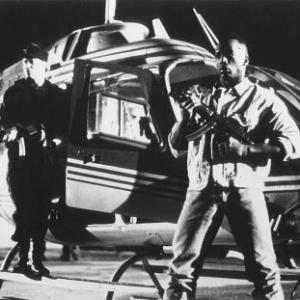 Still of Billy Blanks and Roddy Piper in Tough and Deadly 1995
