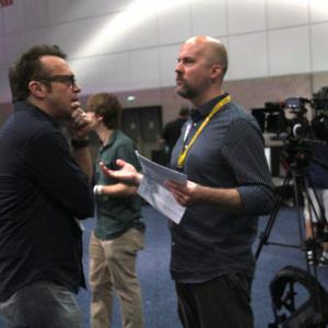 Director Jeremy Snead with host Tom Arnold at E3 2015 for Unlocked The World Of Games Revealed