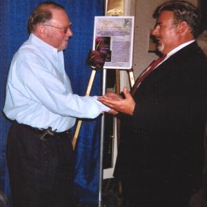 Cummings receiving award