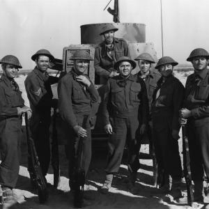 Henry Fonda Reginald Gardiner Allyn Joslyn Peter Lawford and Thomas Mitchell in Immortal Sergeant 1943