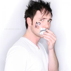 Jesse Kozel poses for the NOH8 campaign