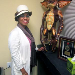 Veronica Loud stands with a Gremlin replica in the offices of Athena Studios in Emeryville, CA during the facility's grand opening.
