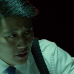 Detective Salem Chow (Gordon G. Lee) shakes down Twitchy (Nicholas Corralez)