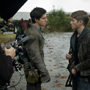 Behindthescenes on the set of the second season of Falling Skies Pictured are Connor Jessup right and Drew Roy center