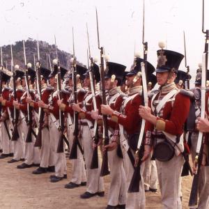 Members of the Cheshire Regiment paying the 26th Foot Cameronians Drill instructorParade director Tim Pickles TaiPan 1986