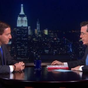 Still of Stephen Colbert and Glenn Greenwald in The Colbert Report 2005