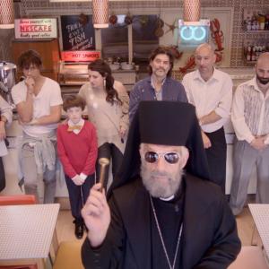Father Jimmy blesses the refurbished Three Brothers Fish & Chip Shop