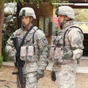 Still of Chris Lowell and Parker Young in Enlisted (2014)