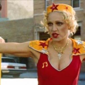 Madonna appears as the singing telegram girl